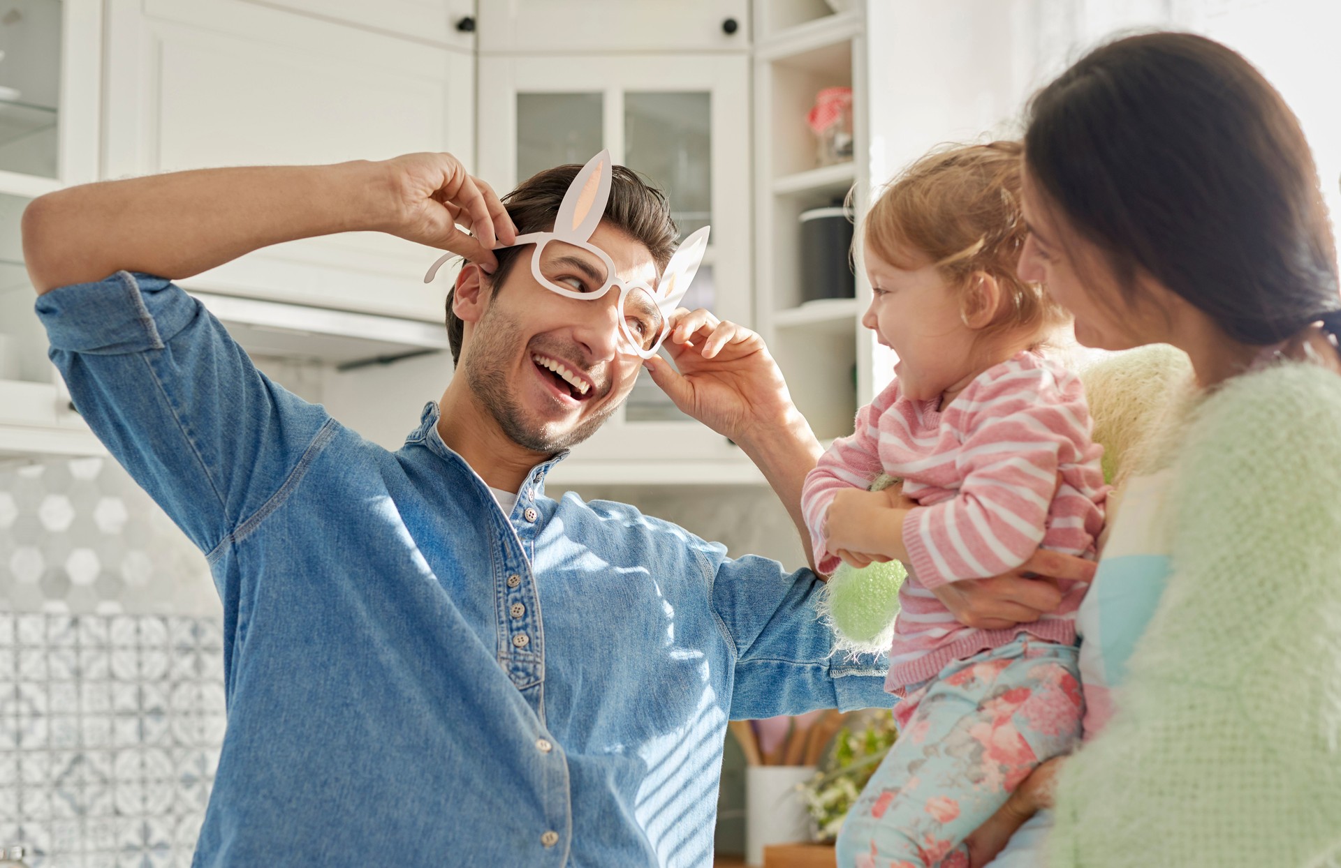 Playful family with baby spending time together